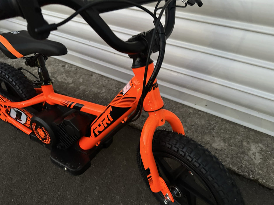 AB Bikes Kids Bikes 12 electric bikes in orange – front side view