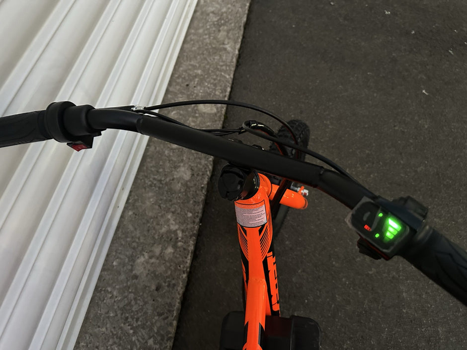 AB Bikes Kids Bikes 12 electric bikes in orange – handbar view