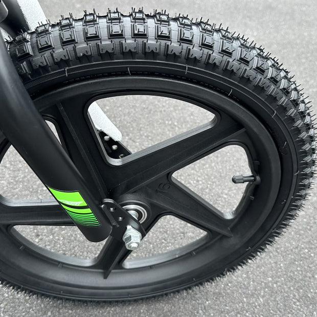 AB Bikes Kids Bikes 16 electric balance bike in green and black – front wheel view