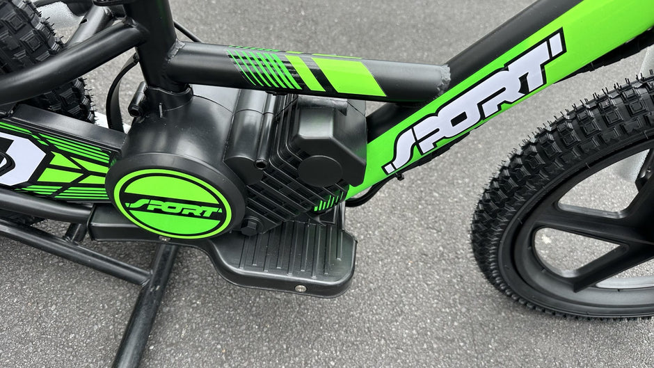 AB Bikes Kids Bikes 16 electric balance bike in green and black – foot pedal view