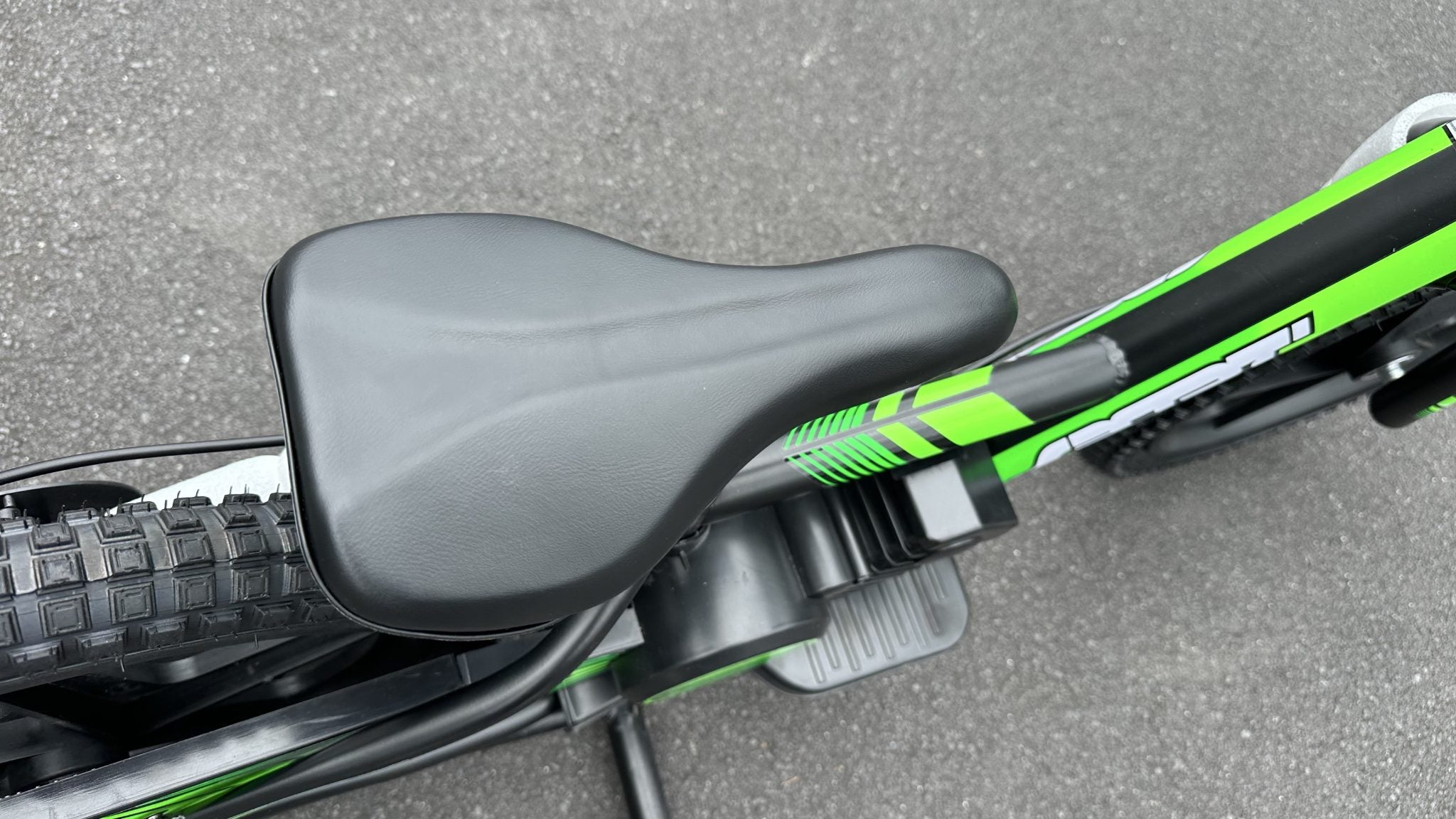 AB Bikes Kids Bikes 16 electric balance bike in green and black – bike seat top view