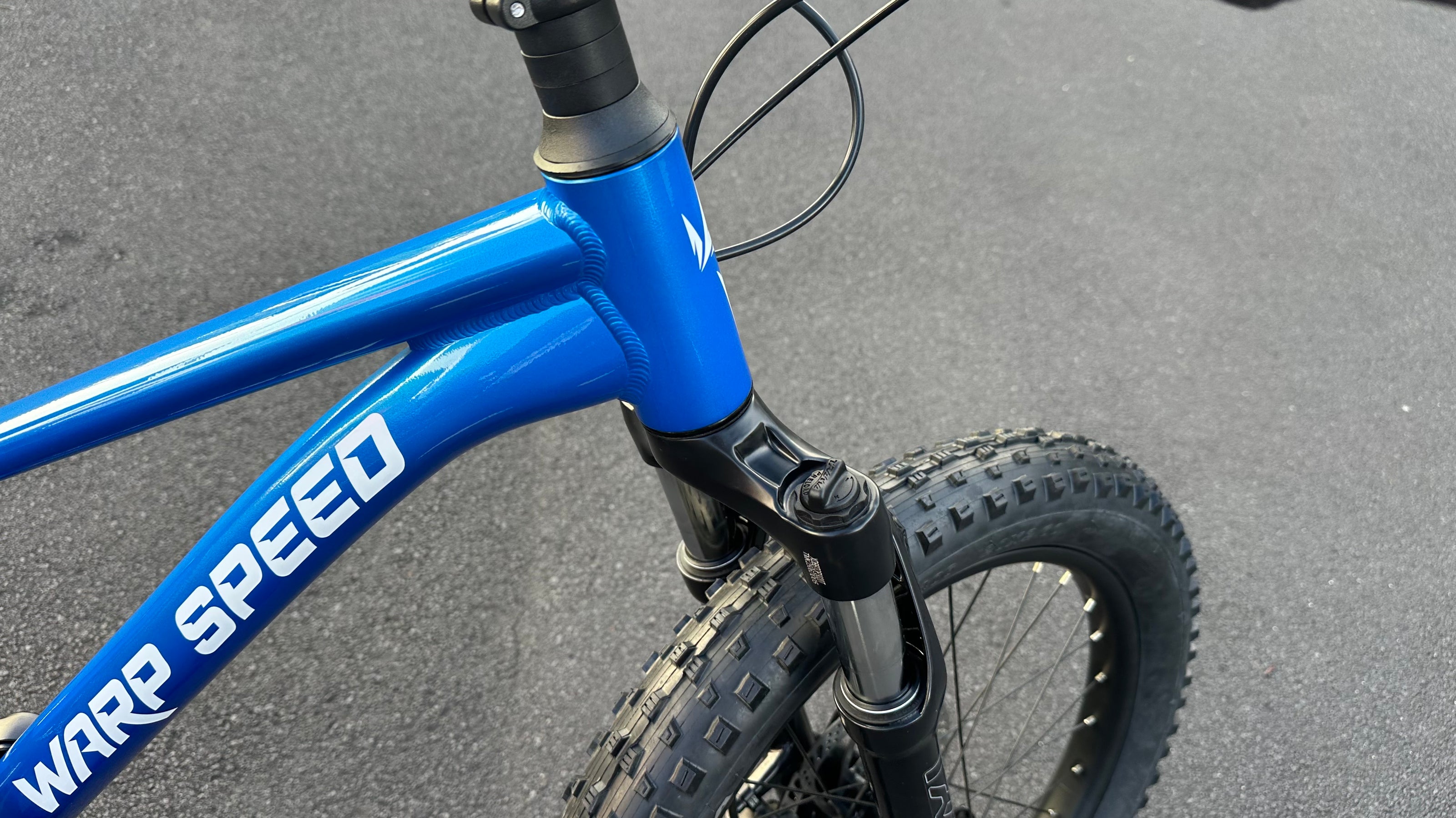 AB Bikes Kids Bikes 20inch Wrap Mountain bike in blue – head tube view