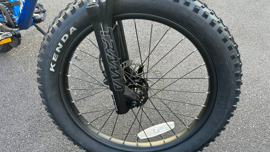 AB Bikes Kids Bikes 20inch Wrap Mountain bike in blue – front wheel view