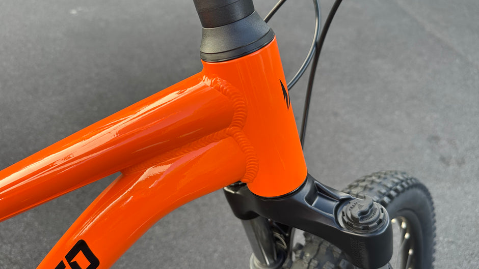 AB Bikes Kids Bikes Wrap Mountain bike in orange – head tube view