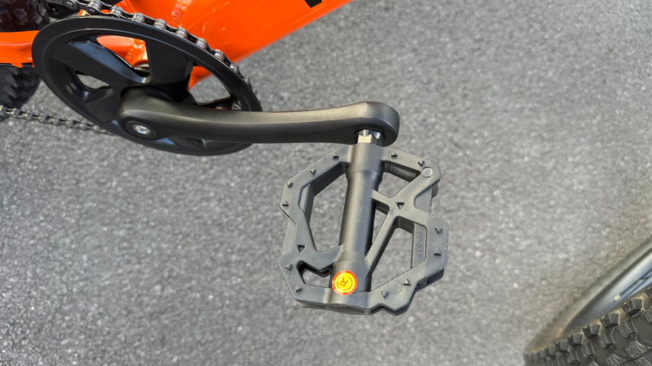 AB Bikes Kids Bikes Wrap Mountain bike in orange – foot pedal view