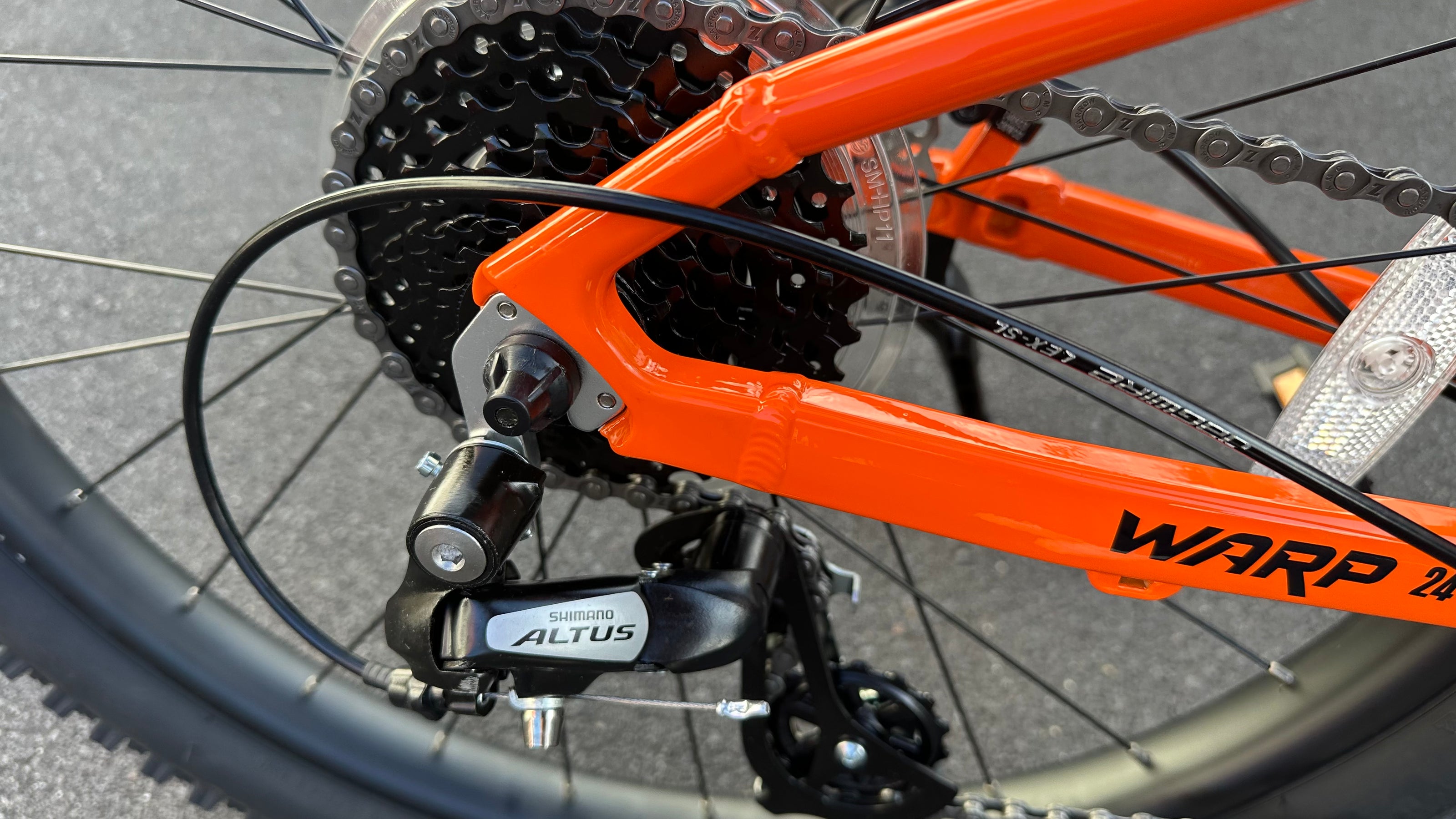 AB Bikes Kids Bikes Wrap Mountain bike in orange – gearing view