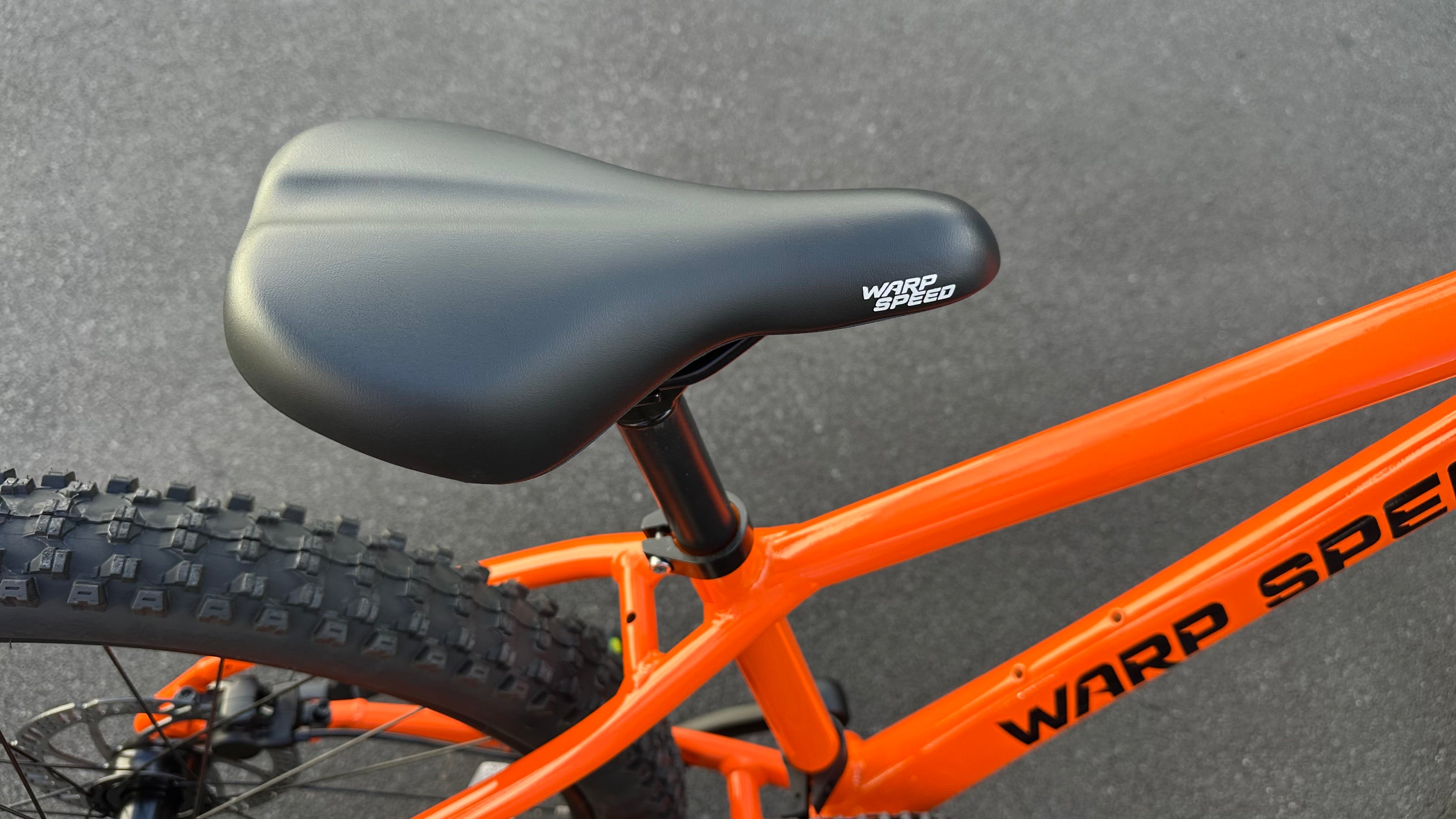AB Bikes Kids Bikes Wrap Mountain bike in orange – bike seat view