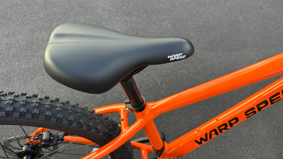 AB Bikes Kids Bikes Wrap Mountain bike in orange – bike seat view
