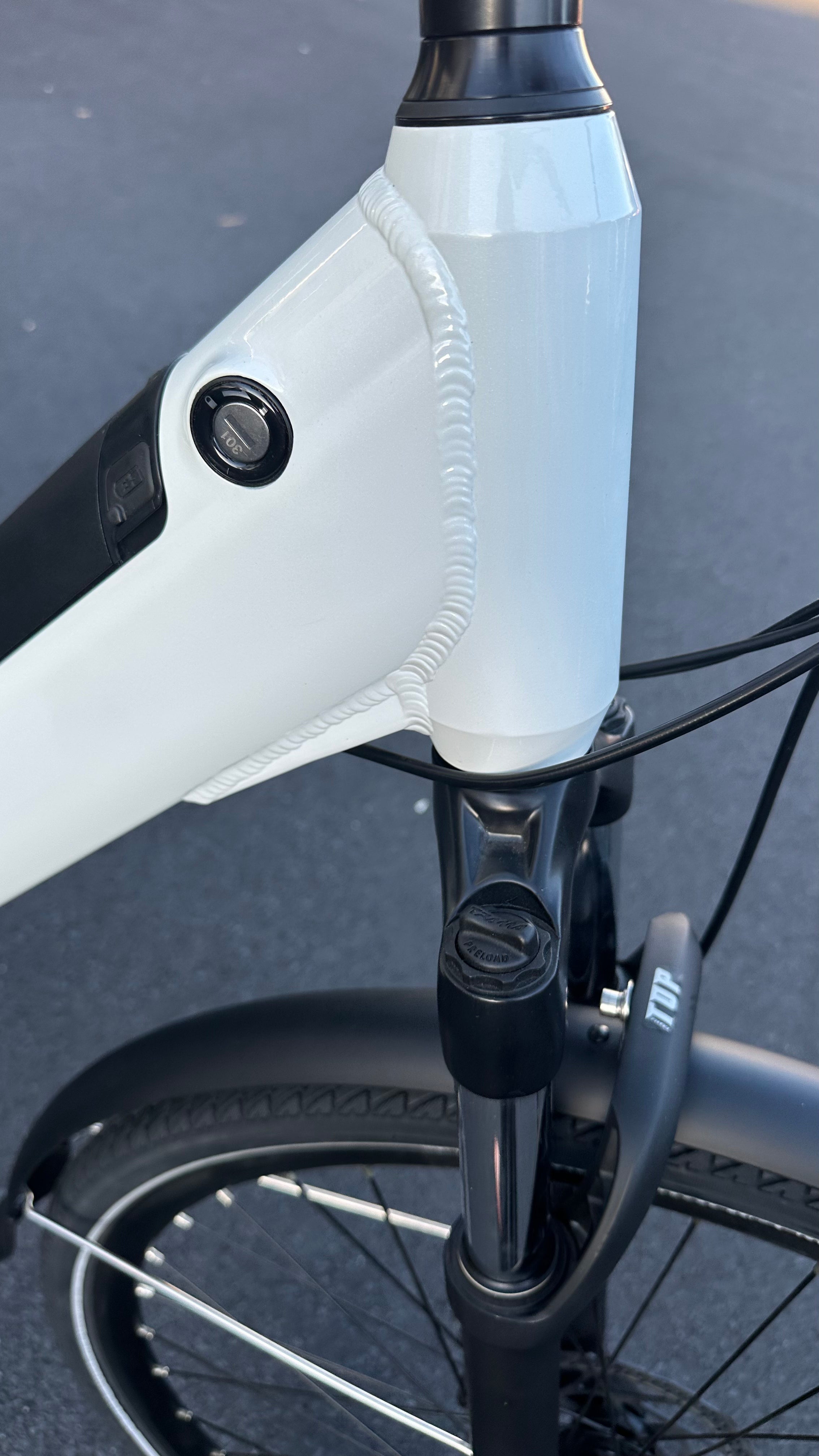 AB Bikes City Electric Assist Bicycle in white – head tube view