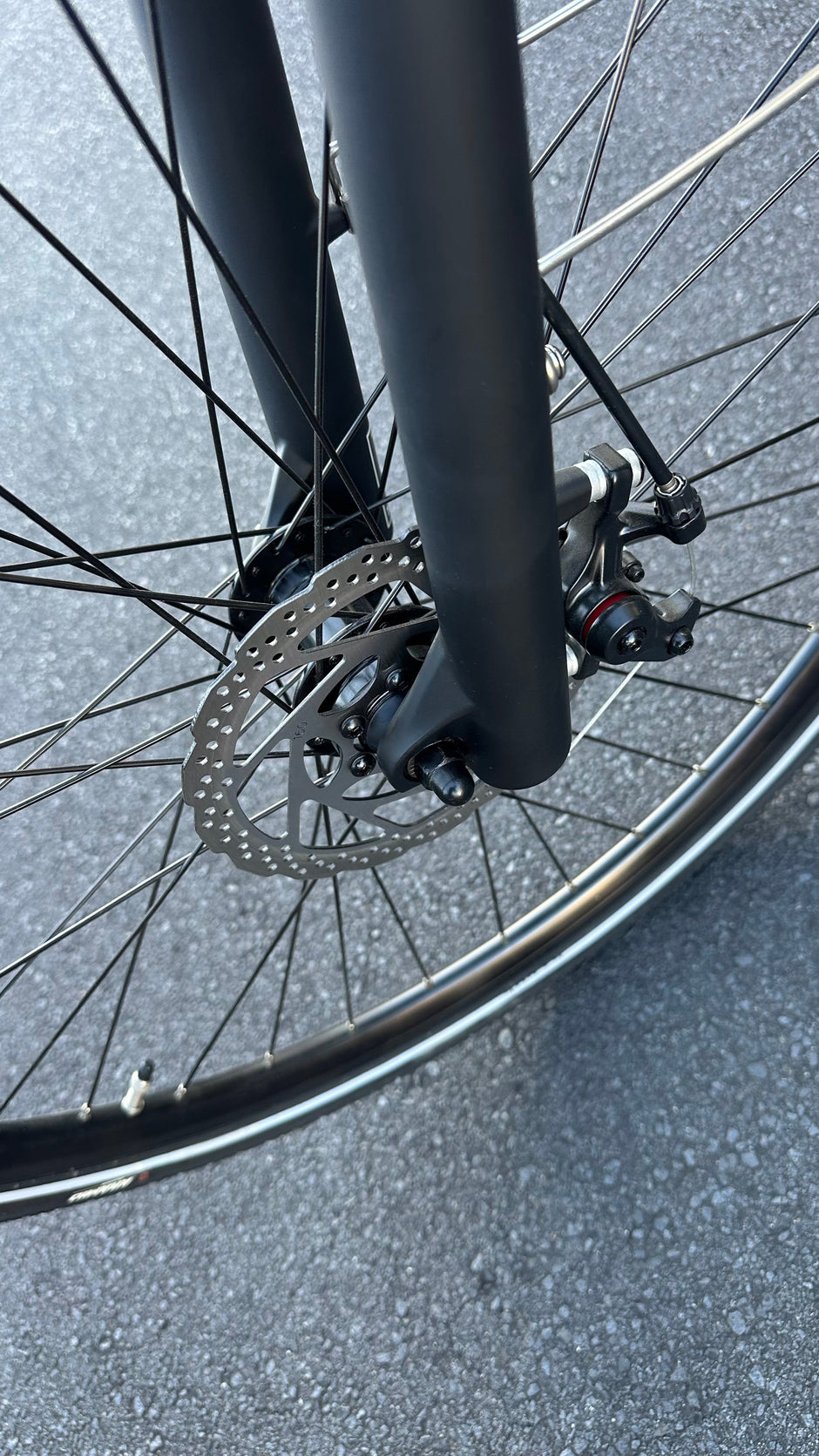 AB Bikes City Electric Assist Bicycle in white – front wheel view