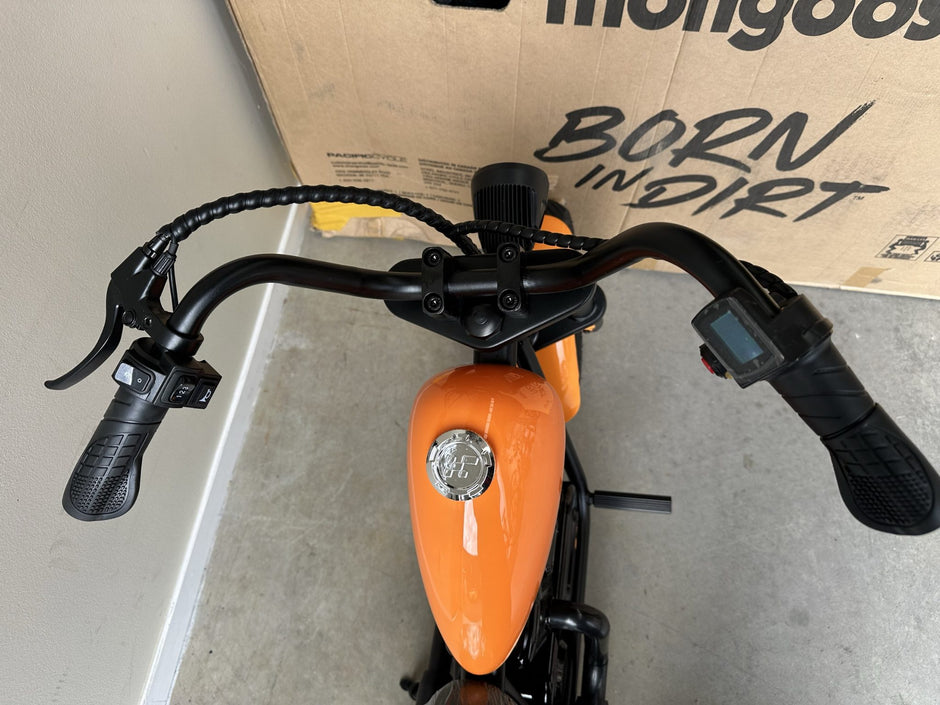 AB Bikes Kid Bike Electric Kids Bike in orange – handbar view