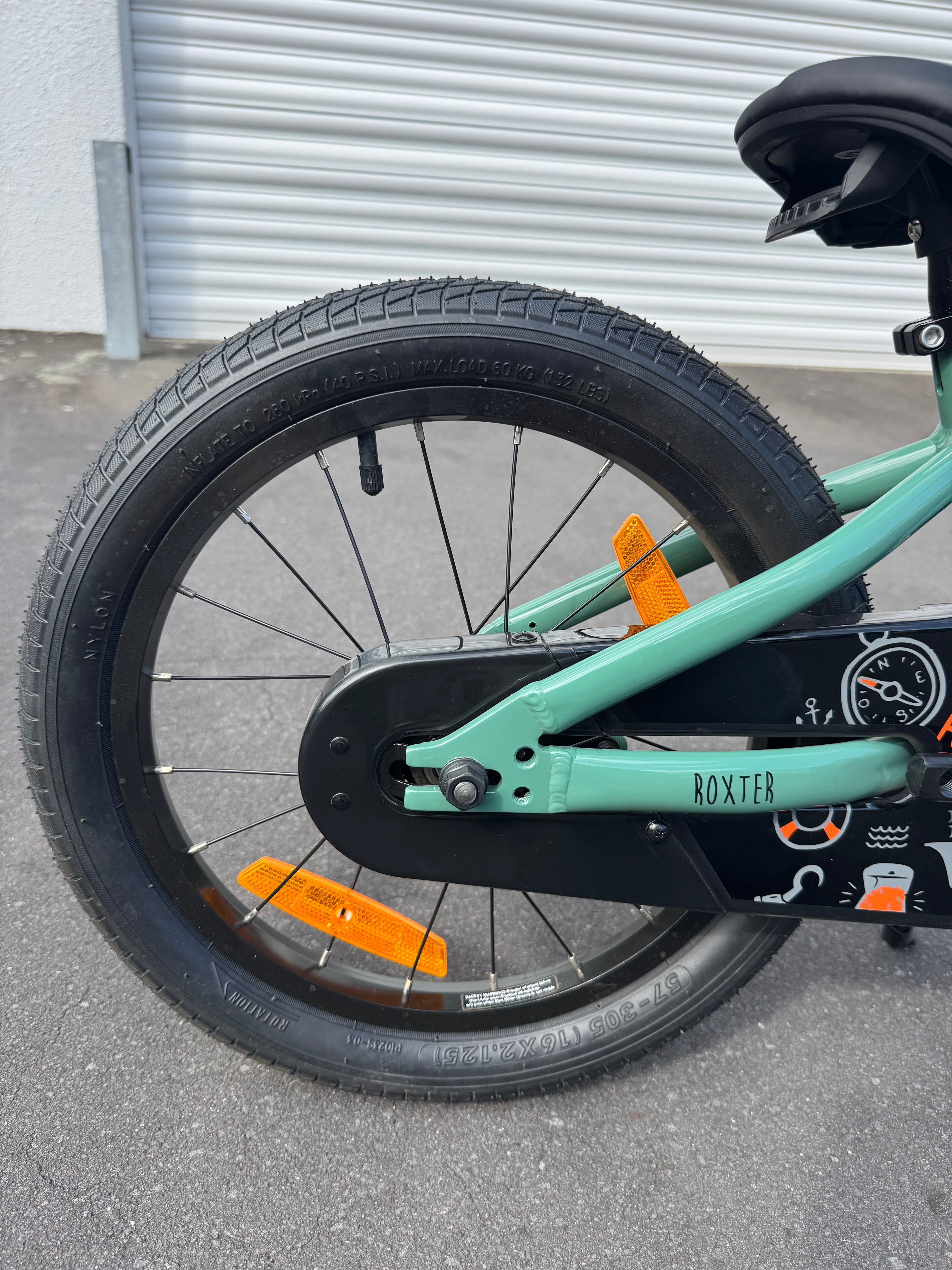 AB Bikes Kid Bike Scott Roxter 16 in green – rear wheel view