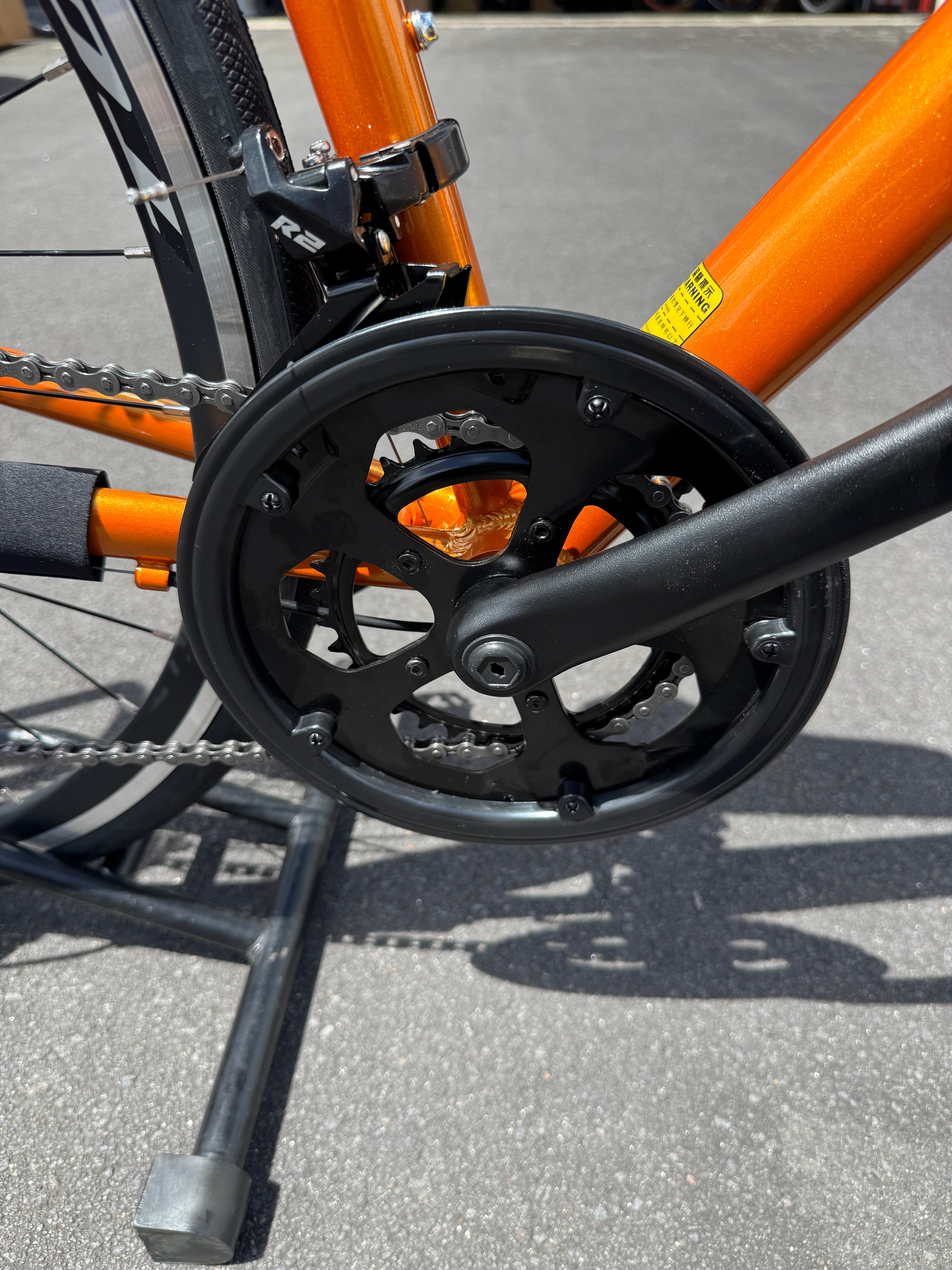 AB Bikes Road Bike Totem in orange – foot pedal view