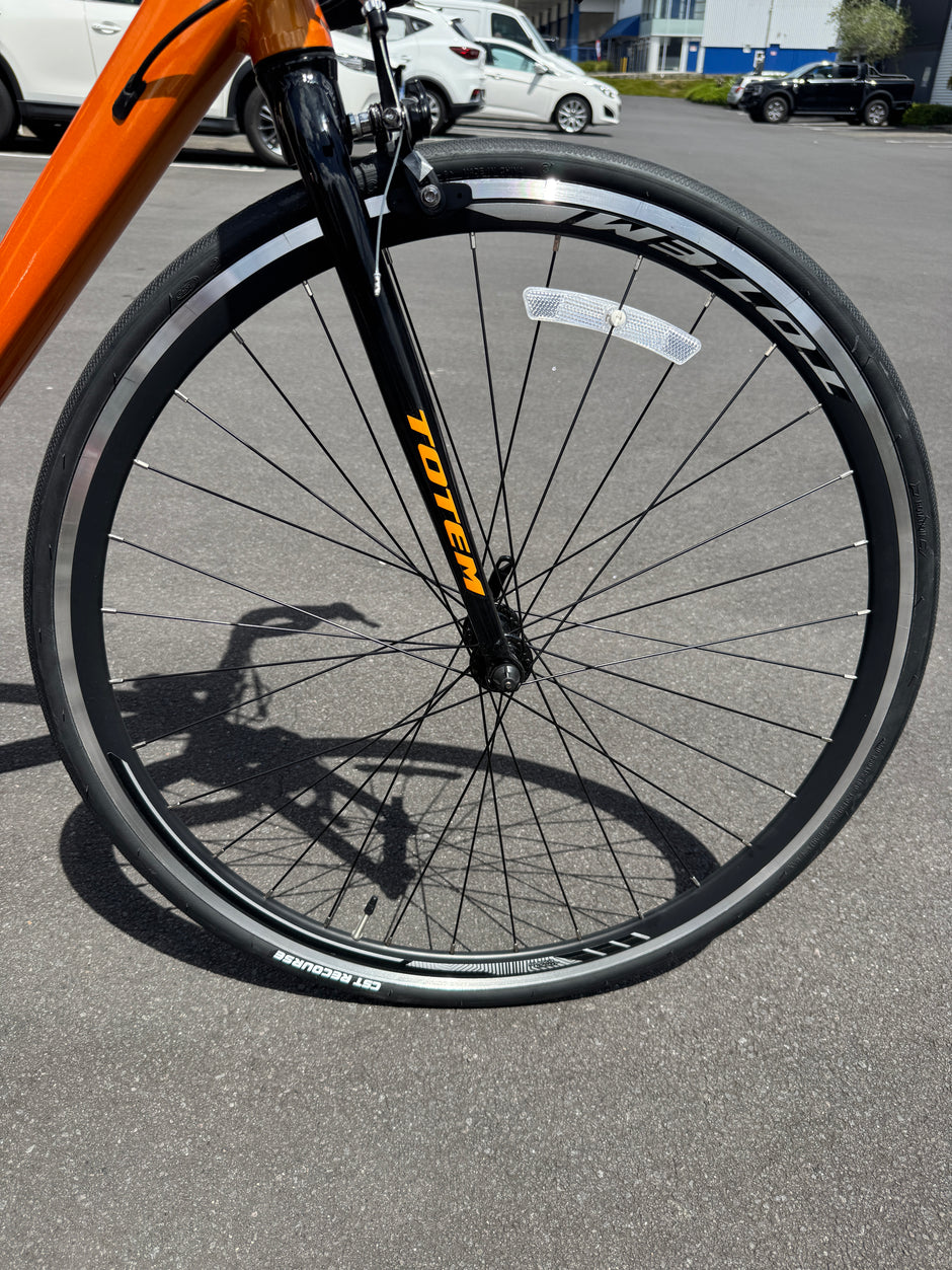 AB Bikes Road Bike Totem in orange – front wheel view